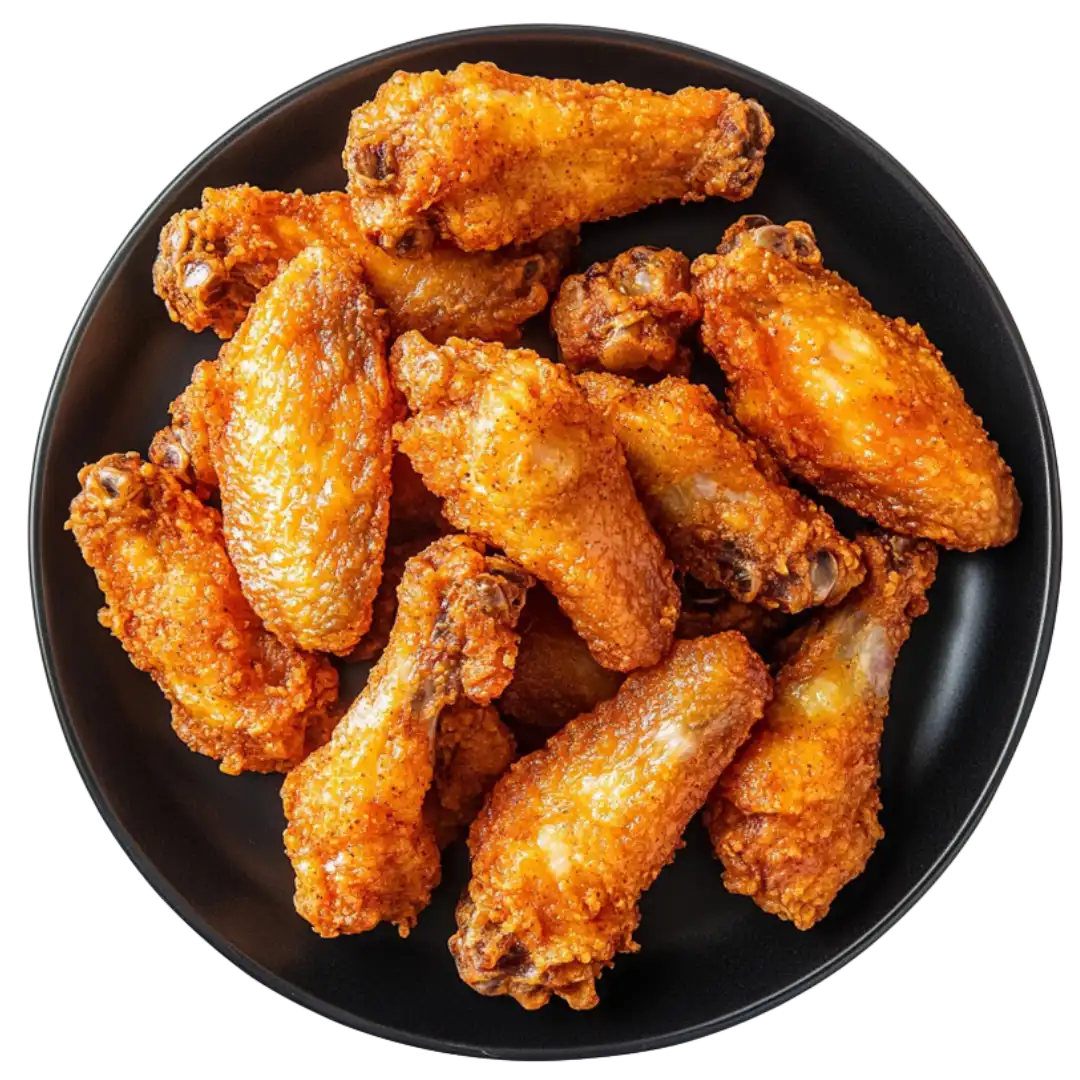 Zoomed-in image of chicken wings being freshly prepared for serving.