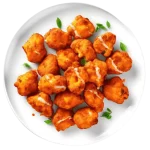 Golden, crispy cauliflower bites served on a platter, ideal for vegetarians.