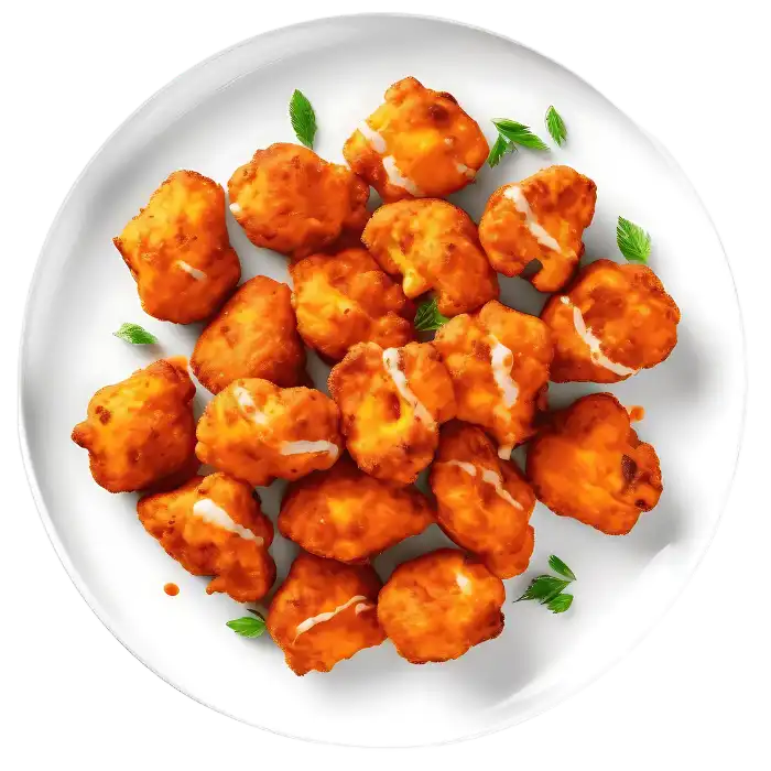 Golden, crispy cauliflower bites served on a platter, ideal for vegetarians.