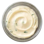 Bowl of creamy garlic dip, a classic pairing for chicken wings.